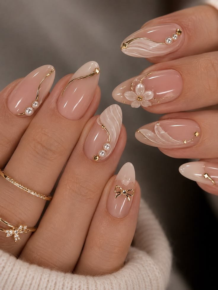 Pearl and gold embellished almond nails